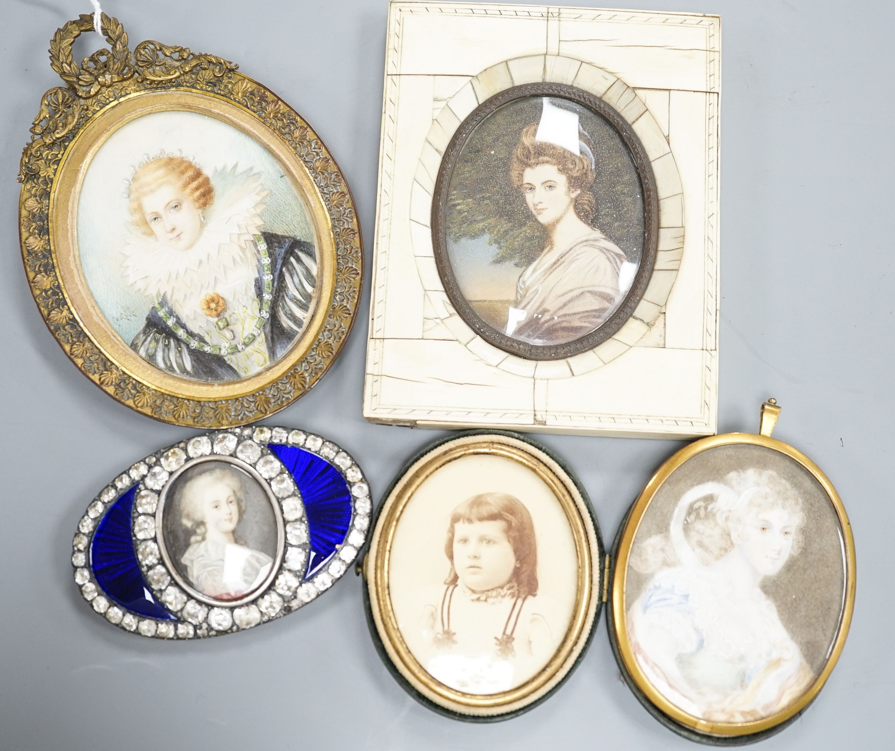 A paste and enamel framed Portrait miniature on ivory, 9.2cm and four other portrait miniatures (three on ivory)